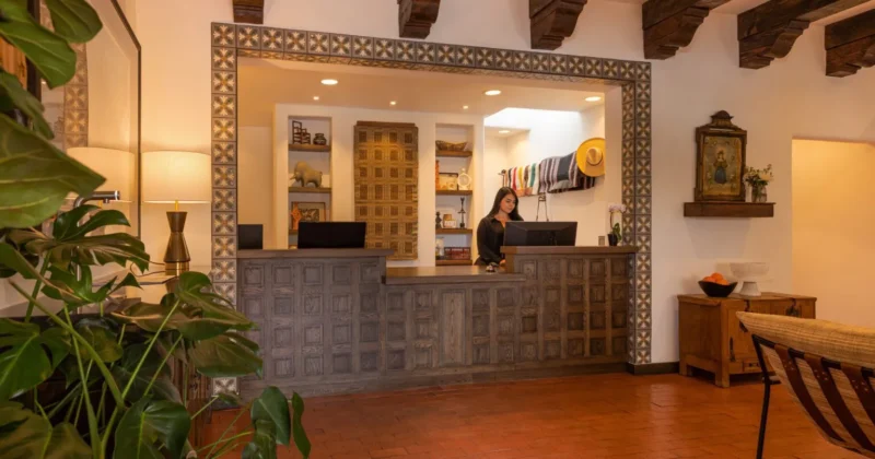Welcoming Spanish Colonial-style hotel reception desk at Piñon Court, one of the best Napa Valley hotels.